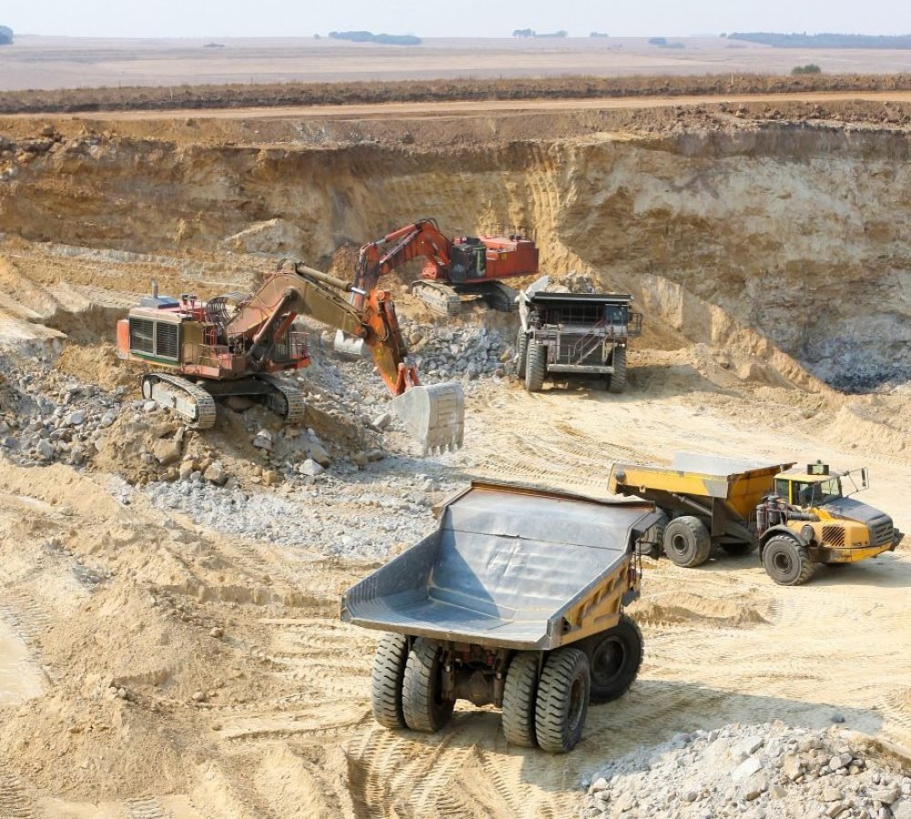 closeup-shot-of-open-pit-coal-mining-with-large-tr-2025-02-03-01-09-37-utc